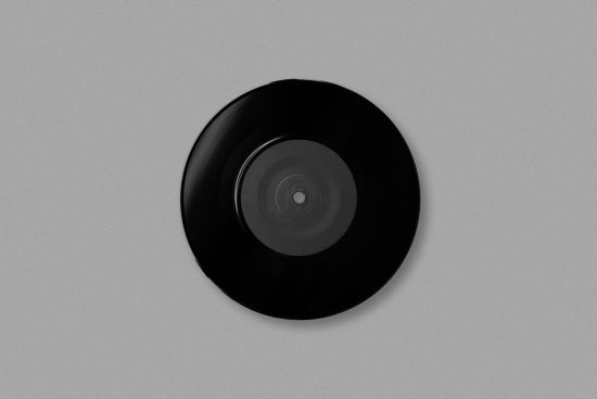 Minimalistic vinyl record mockup centered on a plain background, ideal for music-themed graphics and retro design presentations.