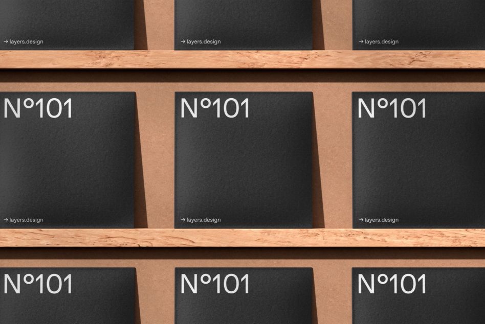 Dark wooden shelves with black boxes labeled N°101