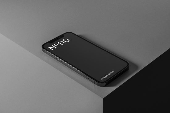Modern smartphone mockup on a dual-tone geometric background, showcasing sleek minimalistic design ideal for contemporary digital presentations.