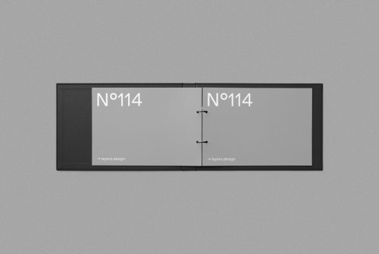 Minimalist black brochure mockup with open spread on textured background for design presentation, graphic display, portfolio showcase.