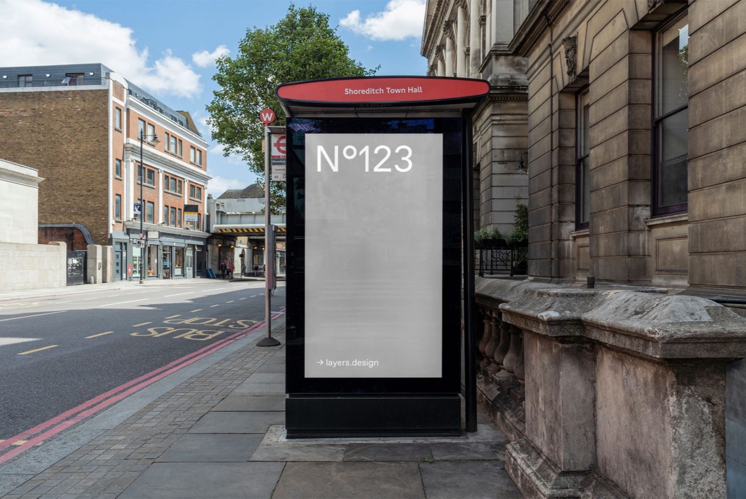 Urban bus stop billboard mockup at Shoreditch Town Hall, clear day for outdoor advertising and poster design presentations.