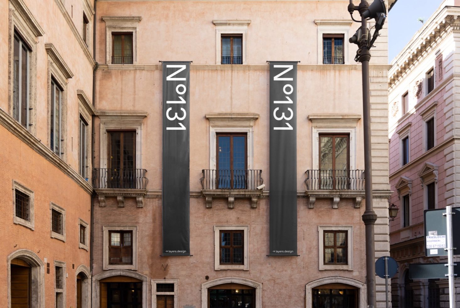 Urban building facade mockup with hanging banners, ideal for presenting branding and advertising designs to clients. Perfect for portfolio display.