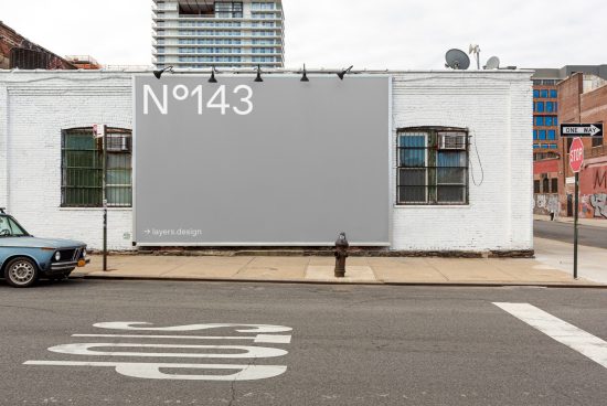 Urban billboard mockup on a white brick building exterior for outdoor advertising, city street background, design asset.