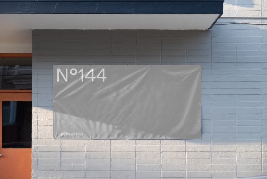 Urban outdoor banner mockup on blue pastel wall in sunlight, realistic texture, perfect for presentation, advertising, layers.design.