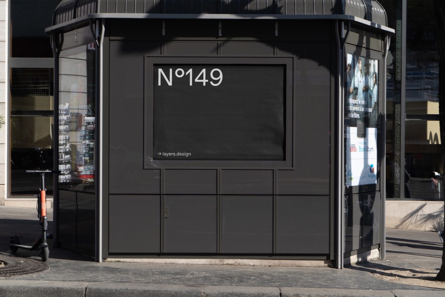 Urban kiosk mockup in daylight showcasing blank advertising billboard for designers to display graphics or branding.