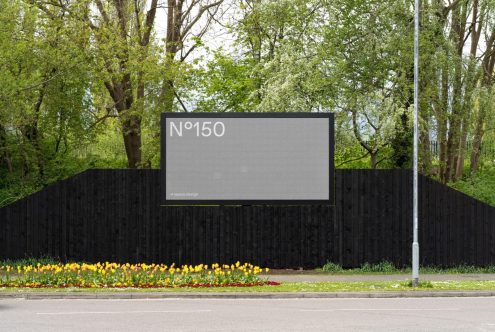 Billboard mockup in urban setting with trees and flowers for outdoor advertising design presentation, clear template for designers to showcase work.