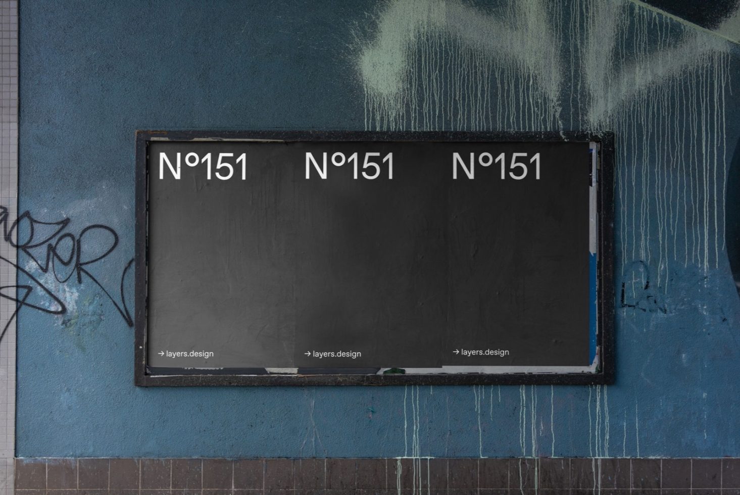 Urban billboard mockup with graffiti on a textured blue wall, ideal for realistic street advertising presentations and graphic displays.