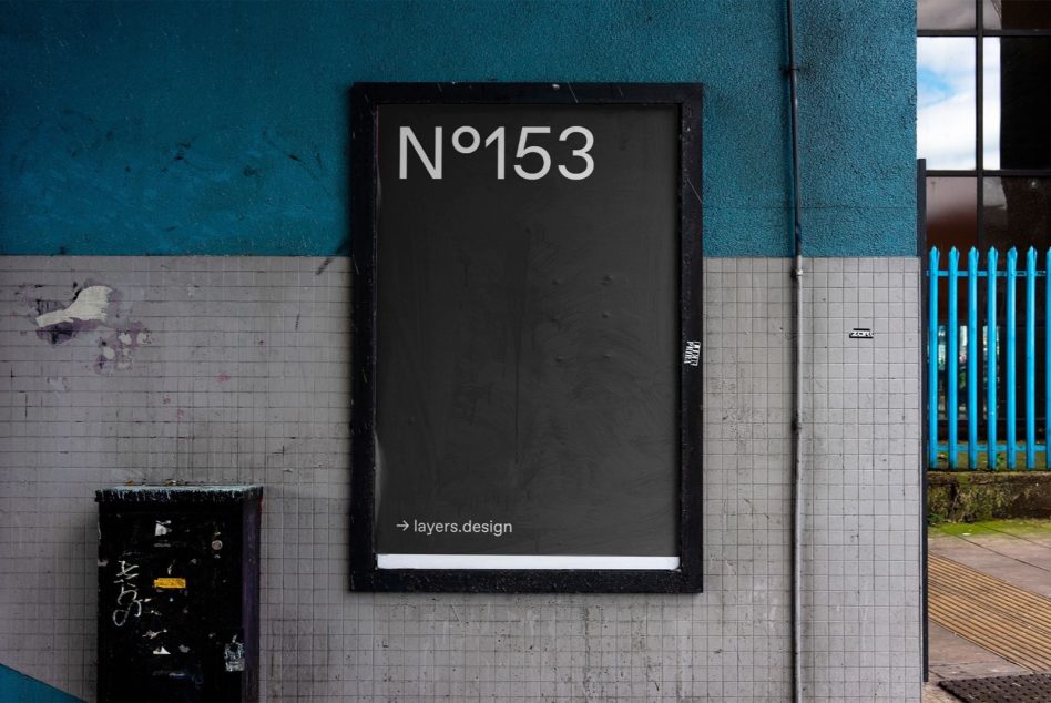 Dark framed sign N°153 mounted on industrial teal wall backdrop