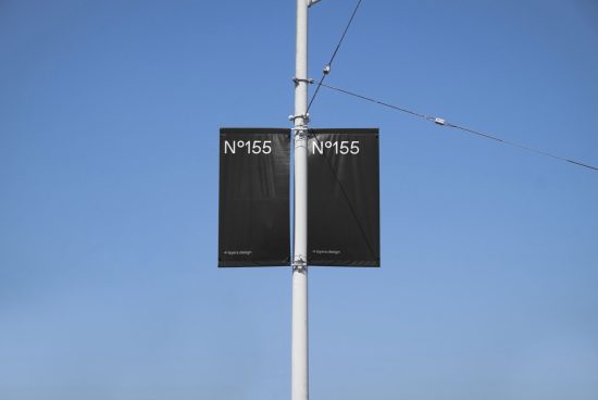 Outdoor banner mockup on a light pole with clear blue sky, showcasing minimalist design for advertising, ideal for designers and templates.
