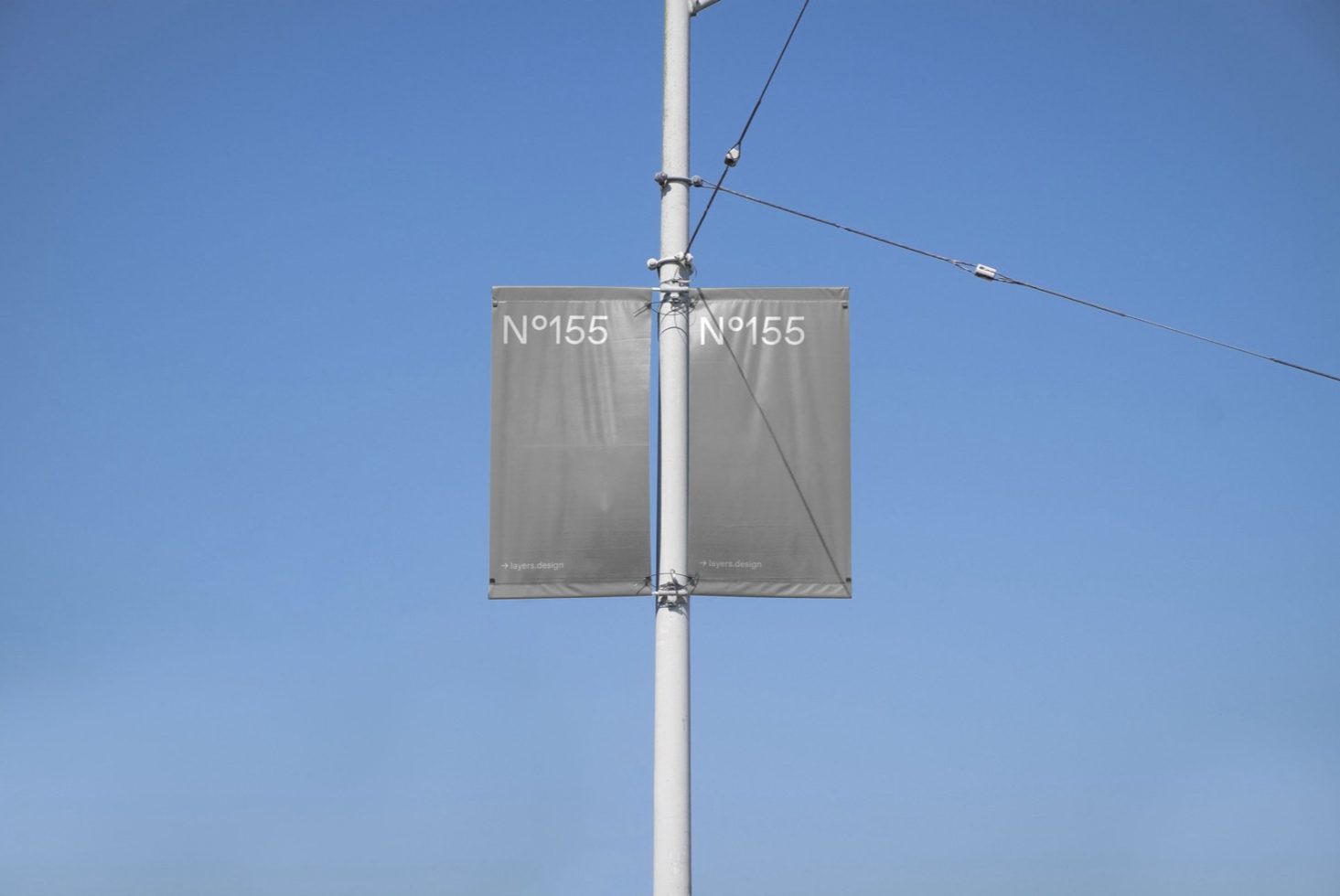 Clear sky background with blank double advertising banners mockup on a lamppost, ideal for design presentations and branding.