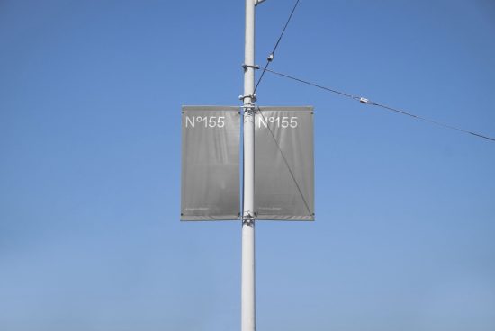 Clear sky background with blank double advertising banners mockup on a lamppost, ideal for design presentations and branding.