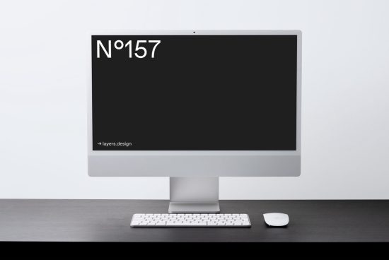 Minimalist computer mockup on desk with keyboard and mouse for digital design presentation, clean workspace setup, modern iMac style display template.