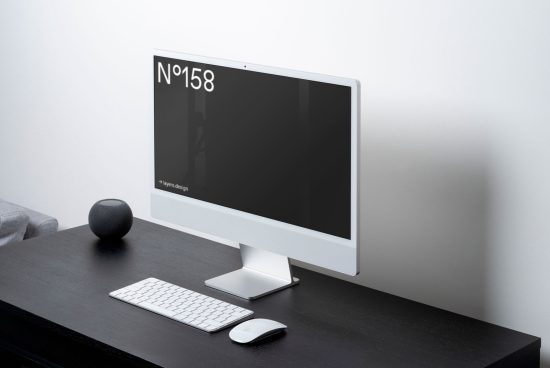 Modern computer monitor mockup on desk with keyboard and speaker perfect for UI design presentation and digital workspace setup.