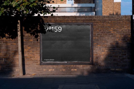 Empty urban billboard mockup on a brick wall for outdoor advertising designs, graphic display preview, realistic street scene.