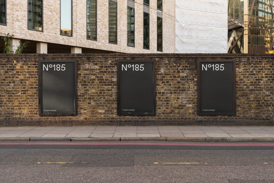 Urban poster mockup on brick wall for outdoor advertising design presentation, blank vertical billboards by sidewalk.