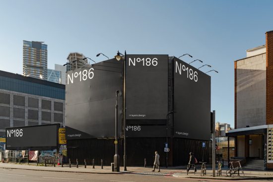 Urban billboard mockup on a black building with clear sky, suitable for presenting outdoor advertising designs.