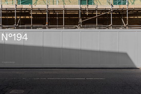 Urban construction site hoarding mockup with shadow play, featuring number 194, ideal for presenting street-level advertising designs.