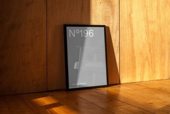 Minimal poster mockup in black frame with sunlight and shadow, wooden floor and wall, design presentation template.