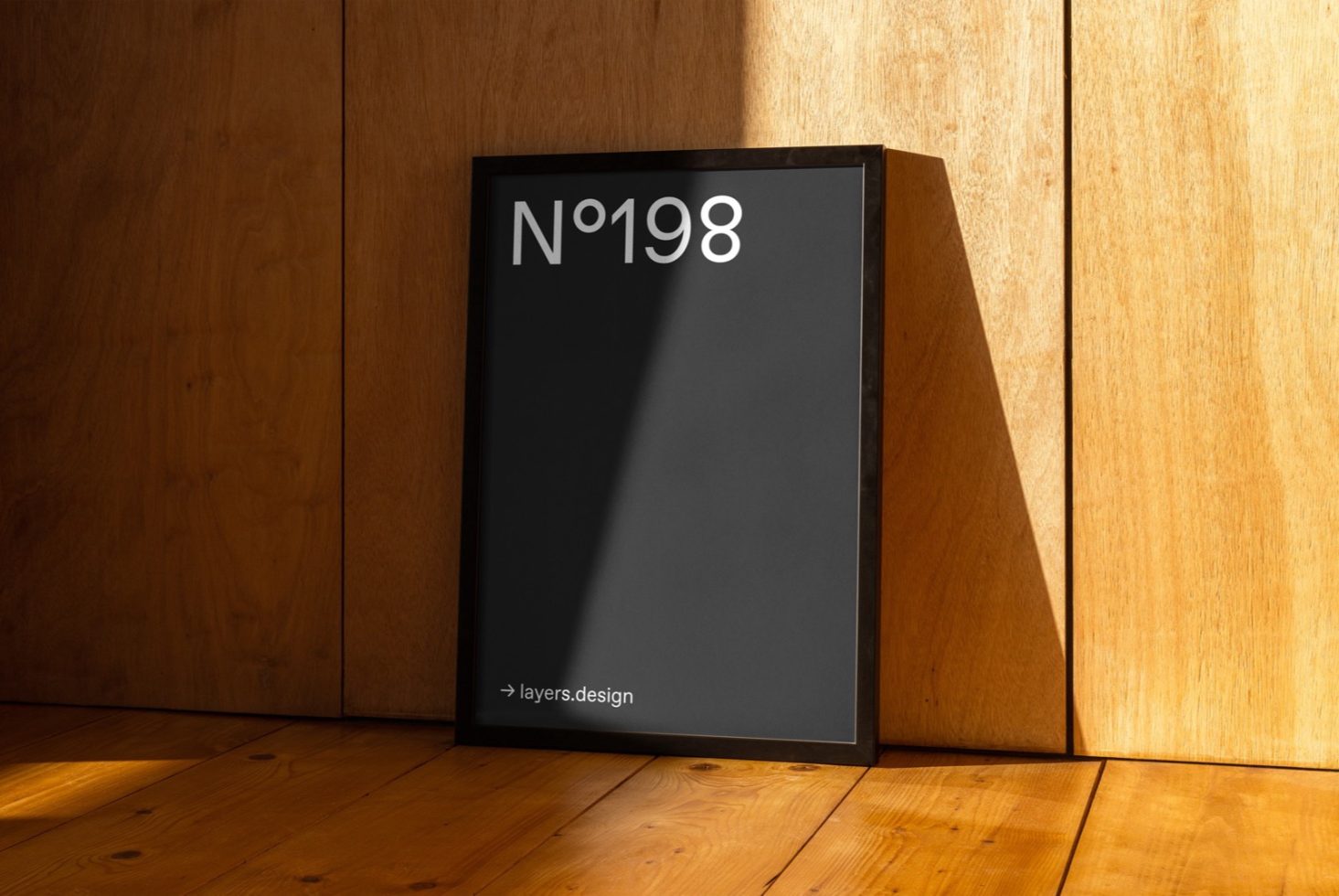 Black magazine mockup cover leaning on wooden wall with natural light shadow, modern presentation for design, clean visual.