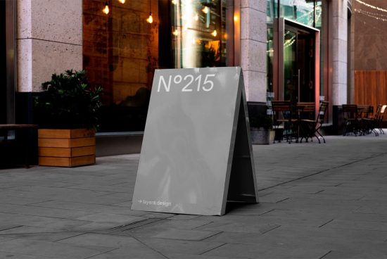 Urban street signage mockup in an outdoor setting, showcasing a customizable sandwich board design with a modern aesthetic for ads and branding.