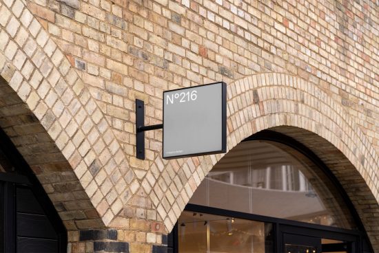 Storefront mockup sign on a brick wall archway, blank customizable template, suitable for graphic design brandingpresentation.