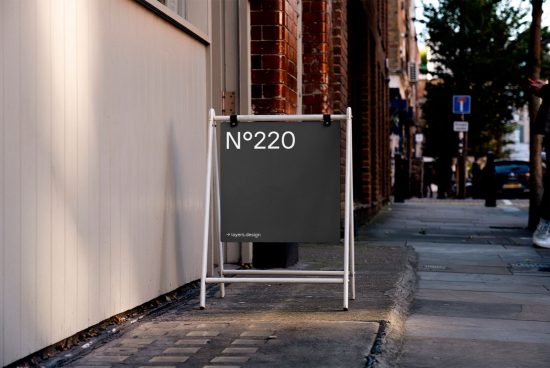 Sidewalk sandwich board mockup with customizable design, urban street setting, perfect for signage and outdoor advertising graphics.