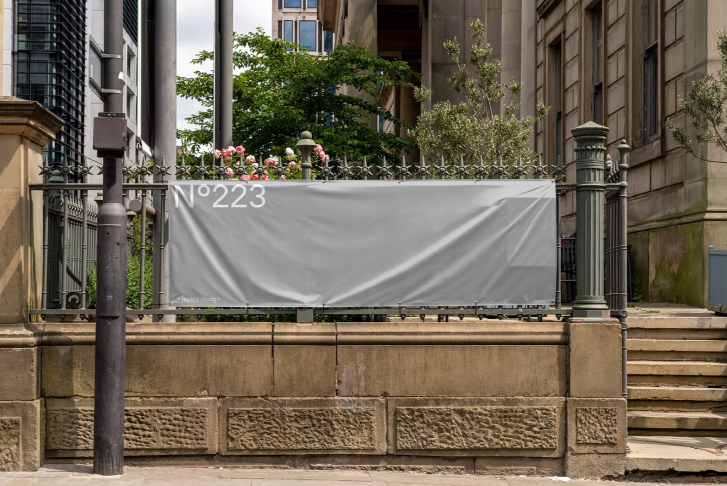 Blank billboard mockup on urban fence for outdoor advertising design presentation, surrounded by city elements with copy space.