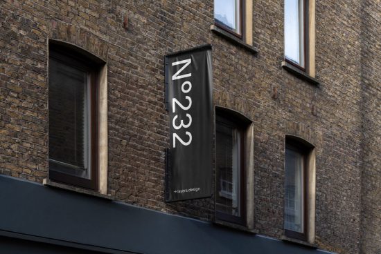 Vertical banner mockup on building facade with typographic design, showcasing clear font display for outdoor advertising, suitable for designers.