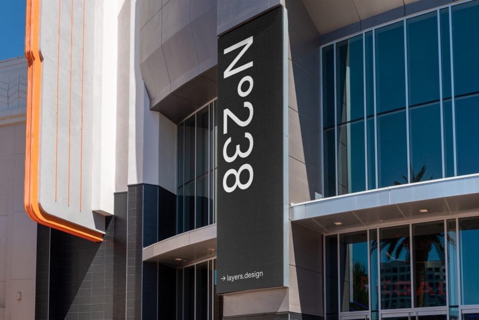 Dark vertical sign N°238 on contemporary architecture with orange neon glow