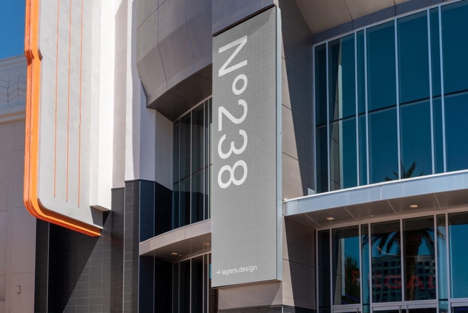 Vertical signage N°238 mounted on modern building facade with neon accent