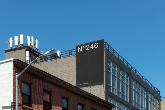 Urban billboard mockup on building facade with clear sky, ideal for graphic designers to showcase advertising designs, billboard marketing, modern mockup.
