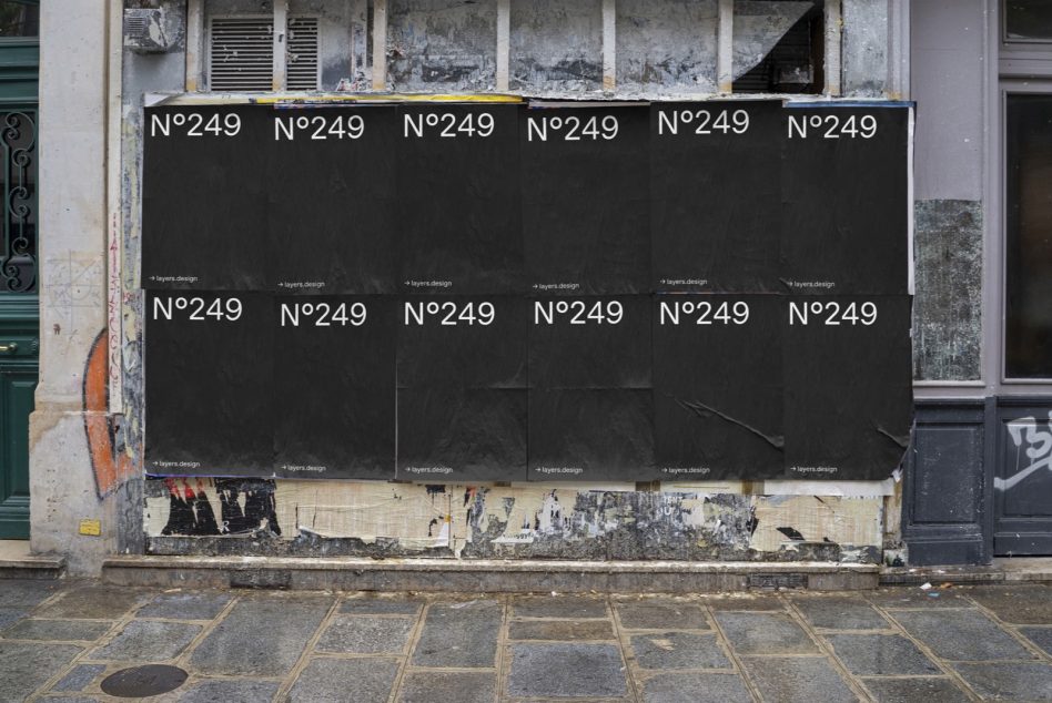 Black outdoor billboard with repeating N°249 text on deteriorated building