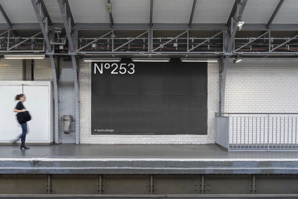 Subway station billboard mockup in urban environment with motion-blurred person walking by, ideal for designers to showcase advertising graphics.