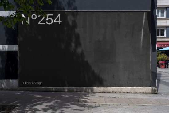 Urban wall with shadow and leaves, ideal for realistic mockup background, graphic design asset, clean textures.