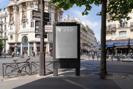 Urban billboard mockup on a sunny street corner with clear space for design presentations, surrounded by Parisian architecture and pedestrians.