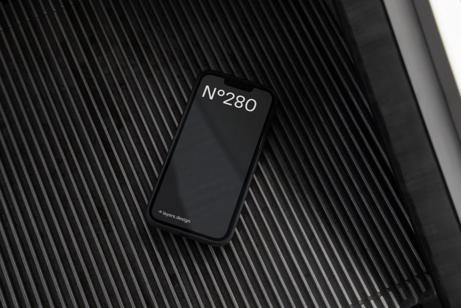 Black iPhone mockup with No.280 label on dark ribbed surface