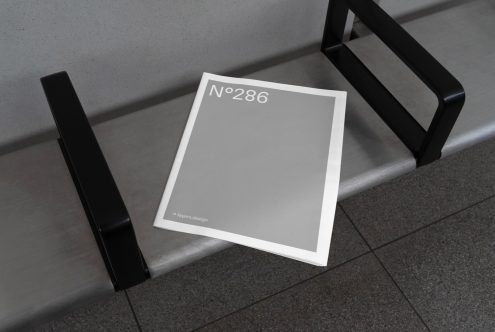 Minimal magazine cover mockup on bench, realistic presentation for graphic design, modern template, clean urban setting, designers' asset.