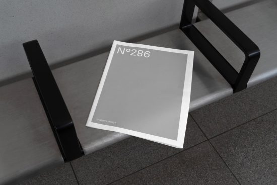 Minimal magazine cover mockup on bench, realistic presentation for graphic design, modern template, clean urban setting, designers' asset.