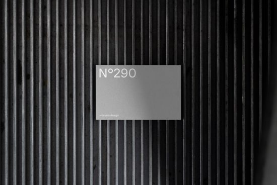 Elegant card mockup with N°290 text set against a textured metal ribbed surface, ideal for designers to showcase branding.