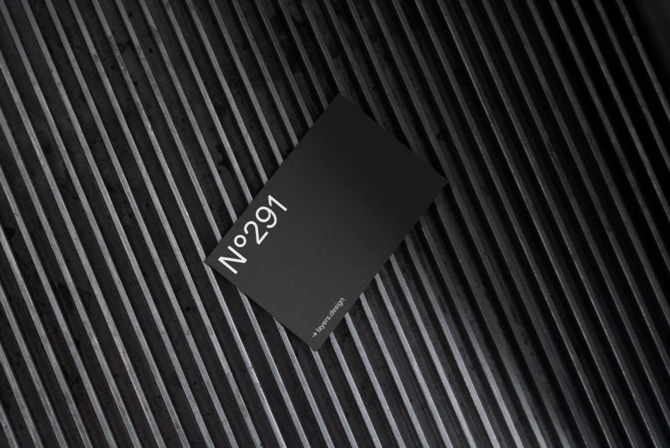 Black card mockup rotated on lined textured backdrop