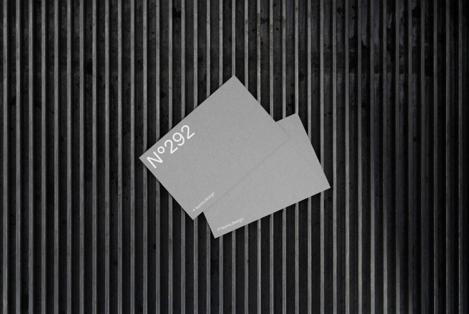 Stacked business cards showing N°292 with layers.design on striped backdrop