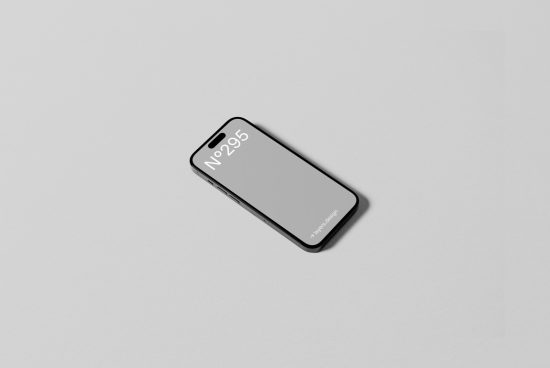 Minimal smartphone mockup on a light grey background, featuring sleek black modern phone design for app presentation and digital assets.
