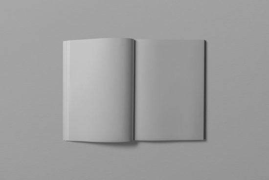 Open blank magazine mockup on grey background, ideal for showcasing custom design work and layout, perfect for graphic designers.