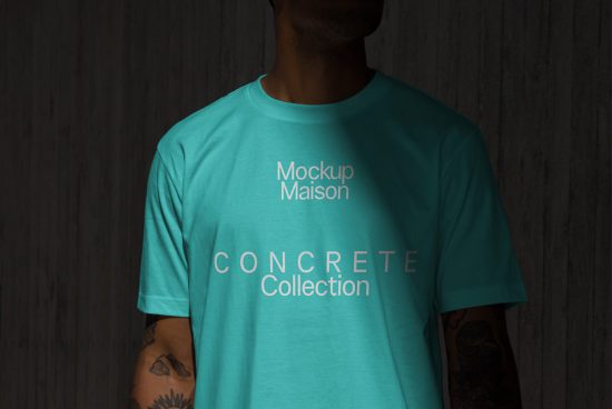 Man in teal t-shirt mockup with text for fashion design presentations on wooden background for graphic designers.