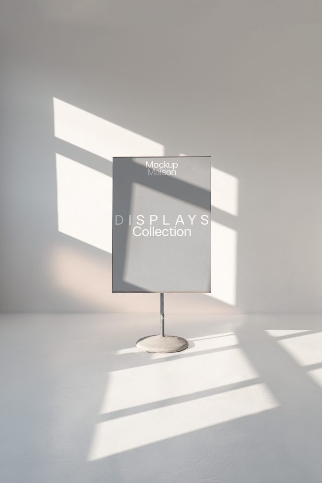 Minimalist display stand mockup in a bright room with dramatic shadows for showcasing design templates and graphics.