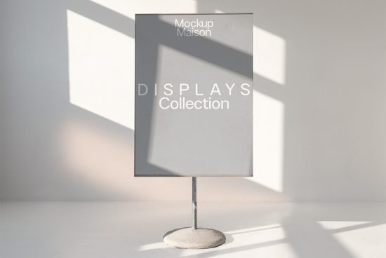 Elegant signage mockup template displayed on a metal stand with natural light and shadows, perfect for showcasing design projects.