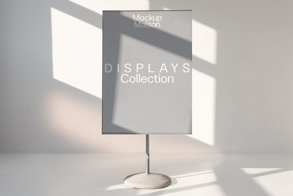 Tabletop display stand mockup with window light casting shadows on gray surface