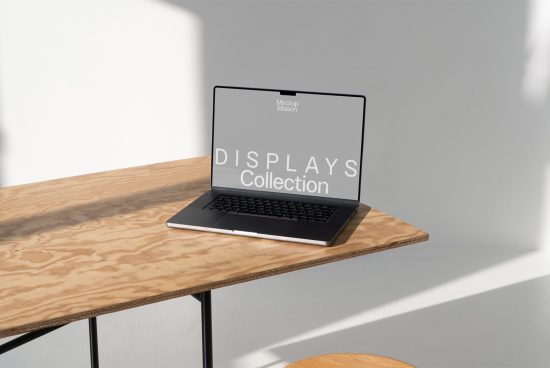 Laptop on wooden table with display mockup in a bright room, ideal for showcasing designs, graphics, fonts, templates, perfect for creative designers.