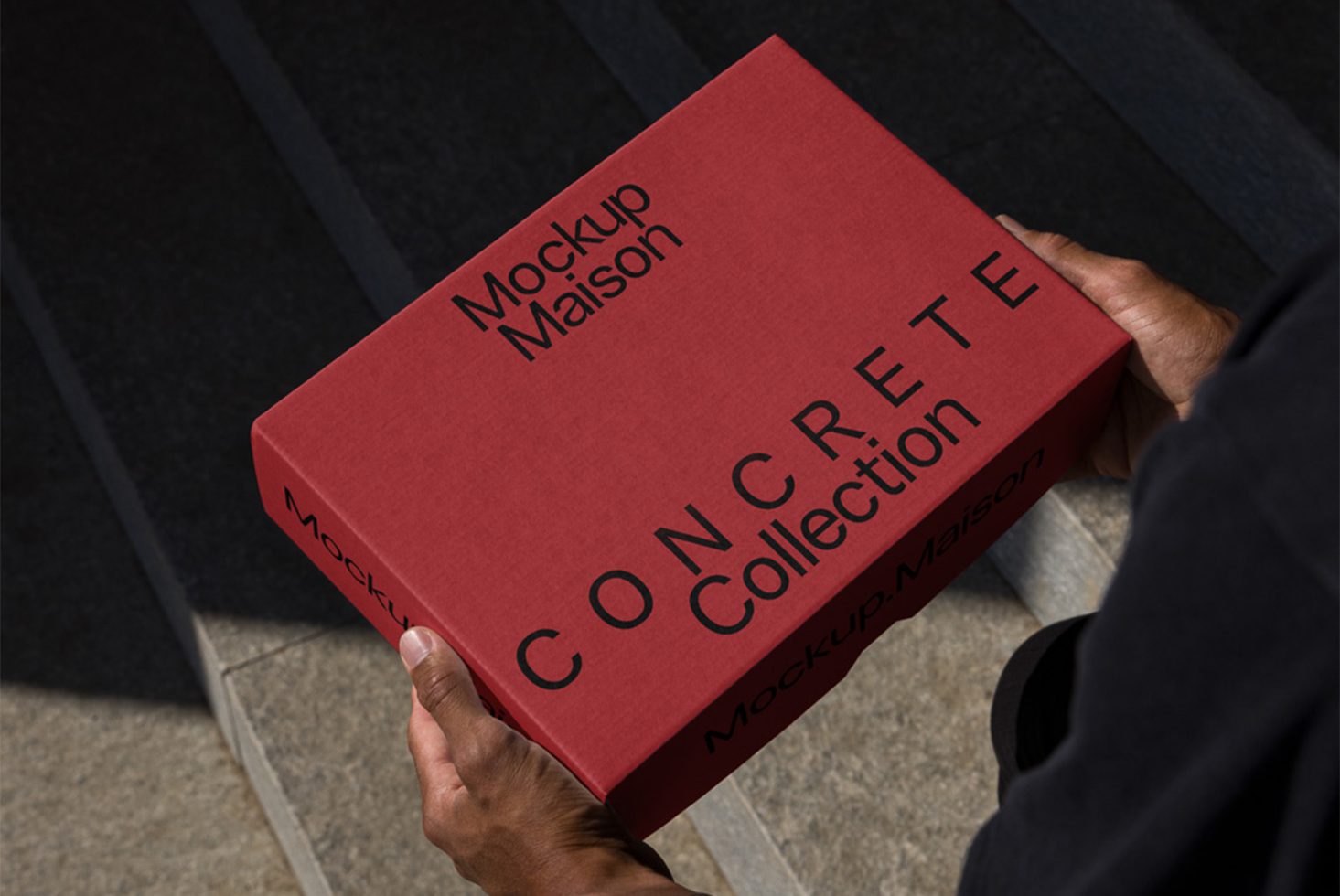 Red product packaging mockup held by a person, concrete collection box design, realistic branding mockup for presentations.