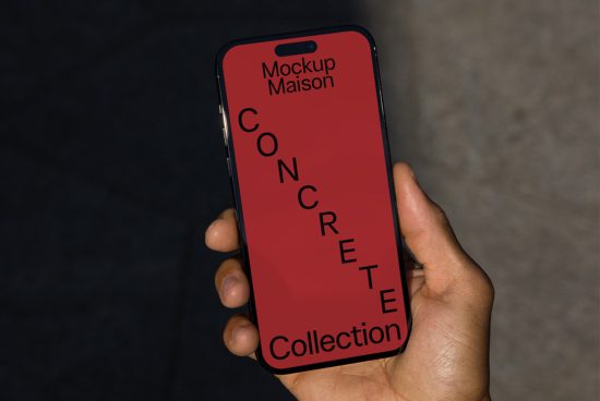 Hand holding smartphone with red screen mockup displaying design text, ideal for presentations, digital assets, designers toolkit.